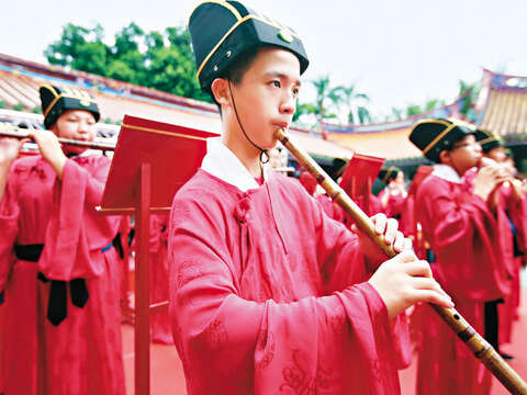 Musicians play ceremonial music.