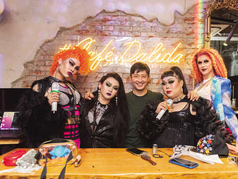 Alvin (middle) has dedicated himself to popularizing drag queen culture, and his drag daughters Yolanda (far left), Kimmy (center left), Elja Heights (far right ), and Marian (center right) who "grew up" at Café Dalida can't thank him enough.