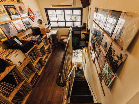 Hidden in a small attic, visitors can enjoy a record hunt in THT Records' cozy space, along with its inviting cafe area.