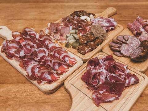 Sliced cured meat is a flavorful appetizer or snack that goes well with many different kinds of beverages.