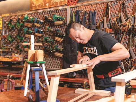 Chiang demonstrates some basic carpentry skills, telling how the profession requires attention to every little detail.