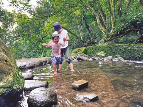 New Pingding Canal connects to the stream at the end of the trail, where shallow water flows slowly by, and is a perfect spot for kids to dip in the water.